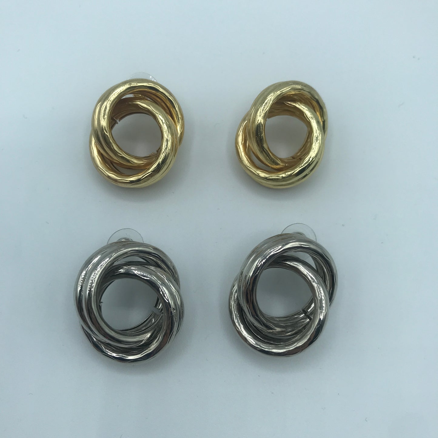Crossed hoop earrings