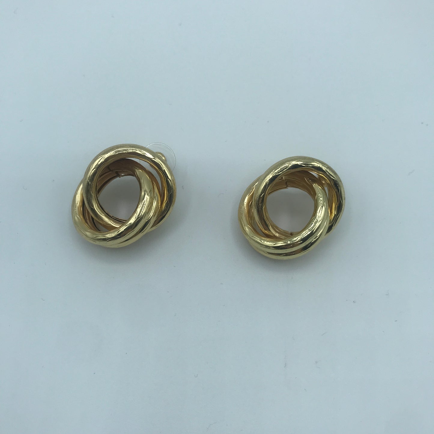 Crossed hoop earrings