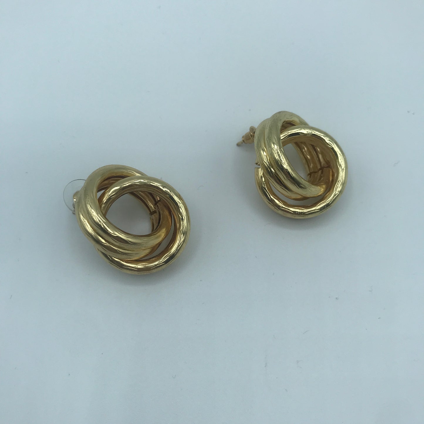 Crossed hoop earrings