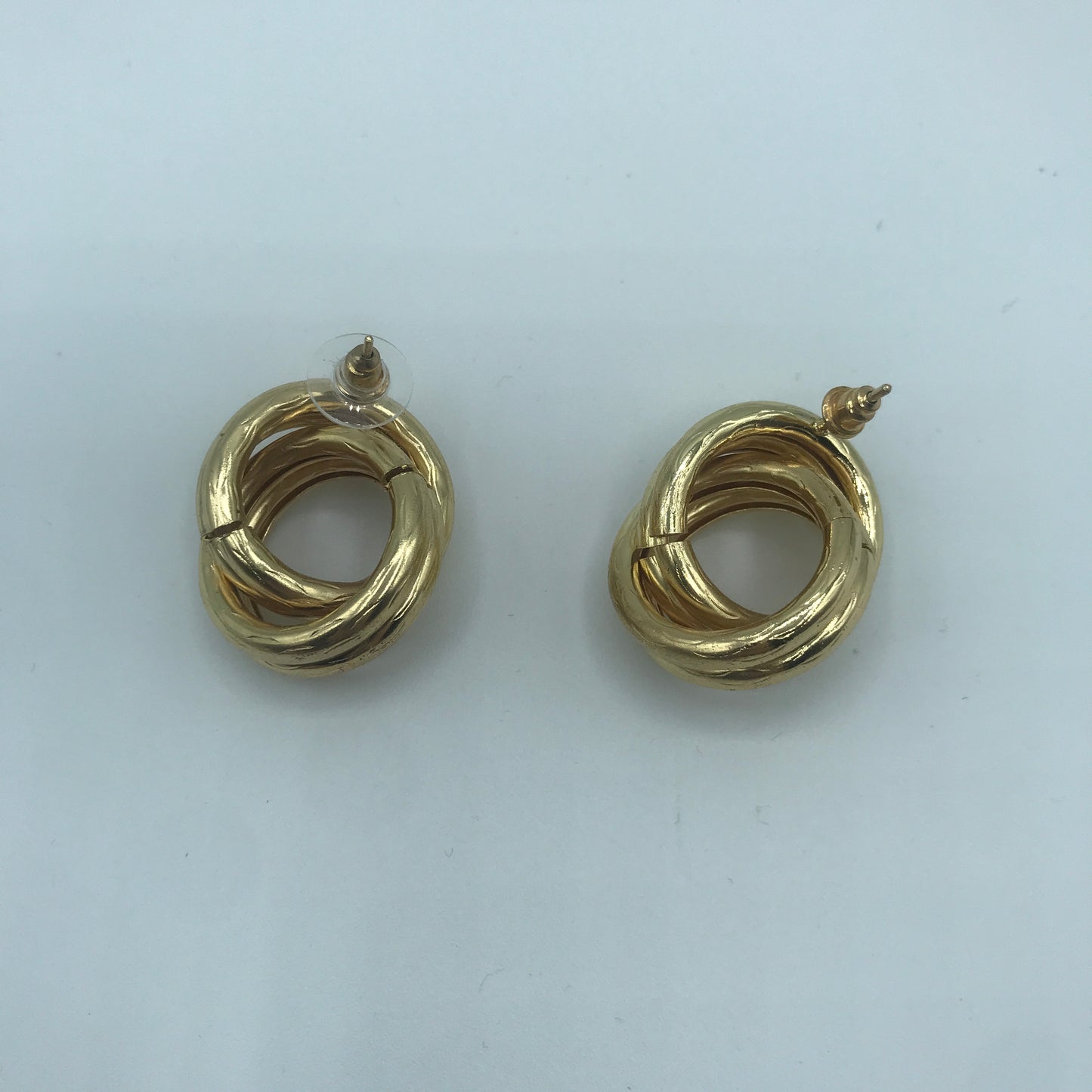Crossed hoop earrings