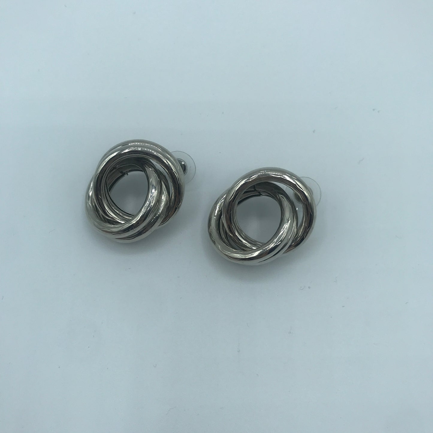 Crossed hoop earrings
