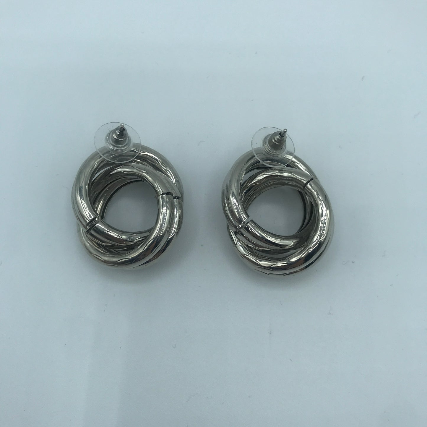 Crossed hoop earrings