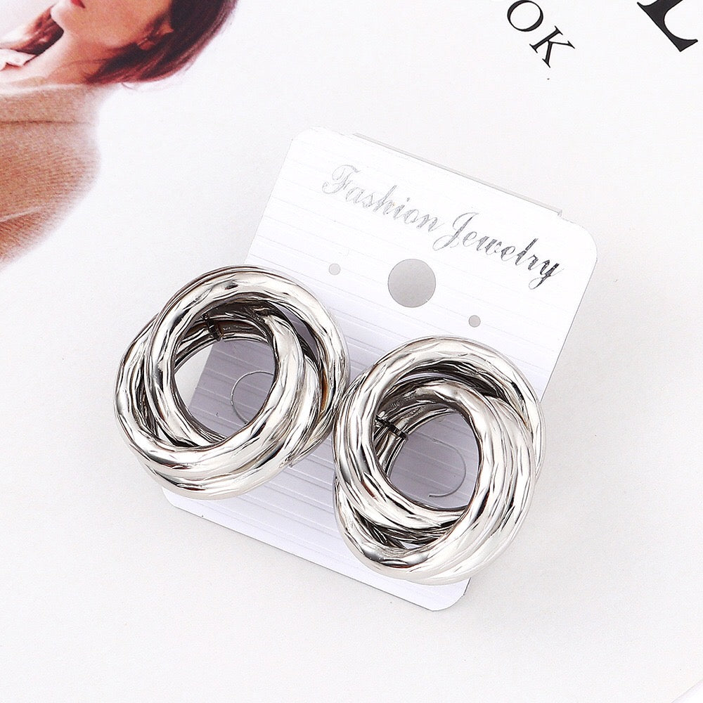 Crossed hoop earrings
