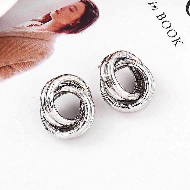 Crossed hoop earrings