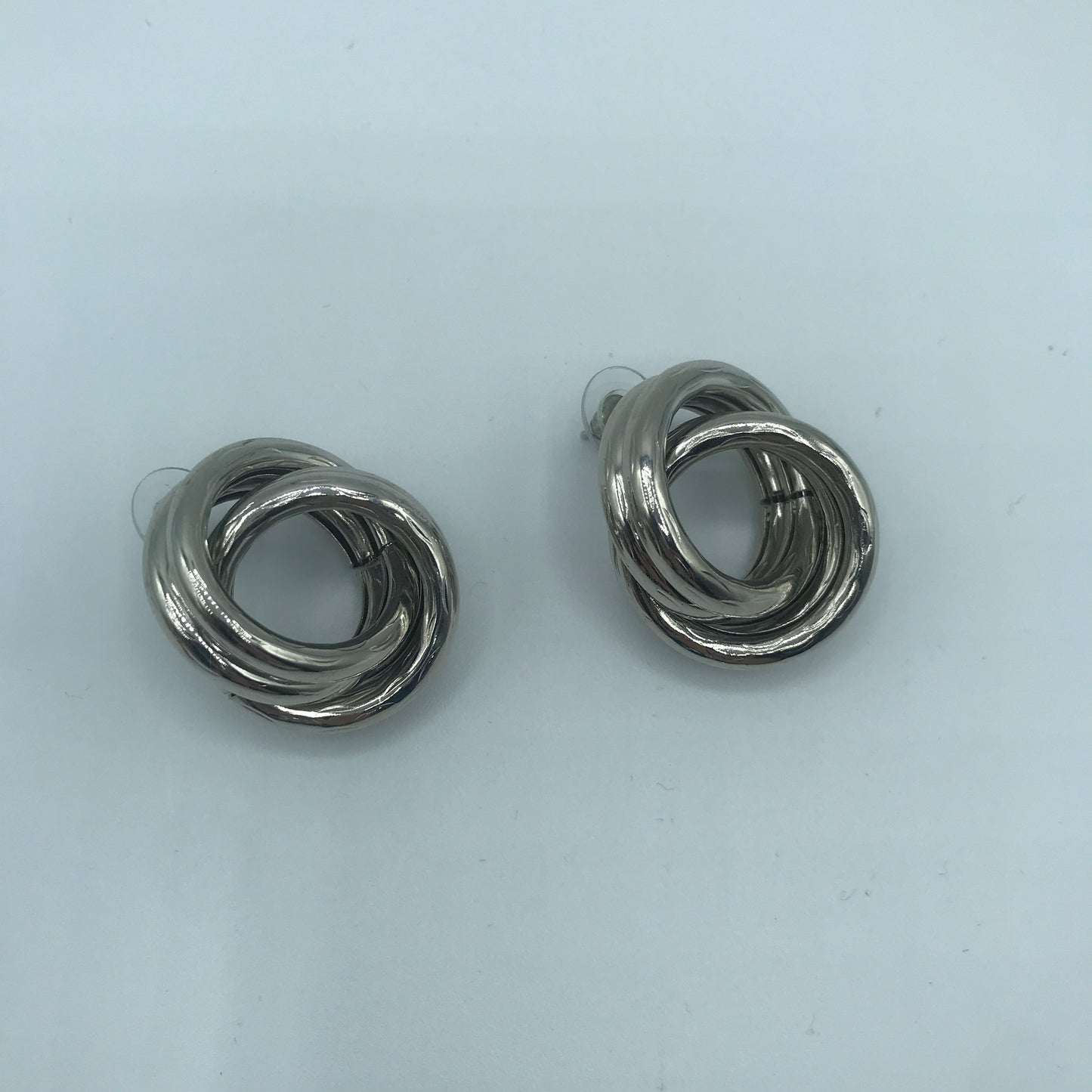 Crossed hoop earrings